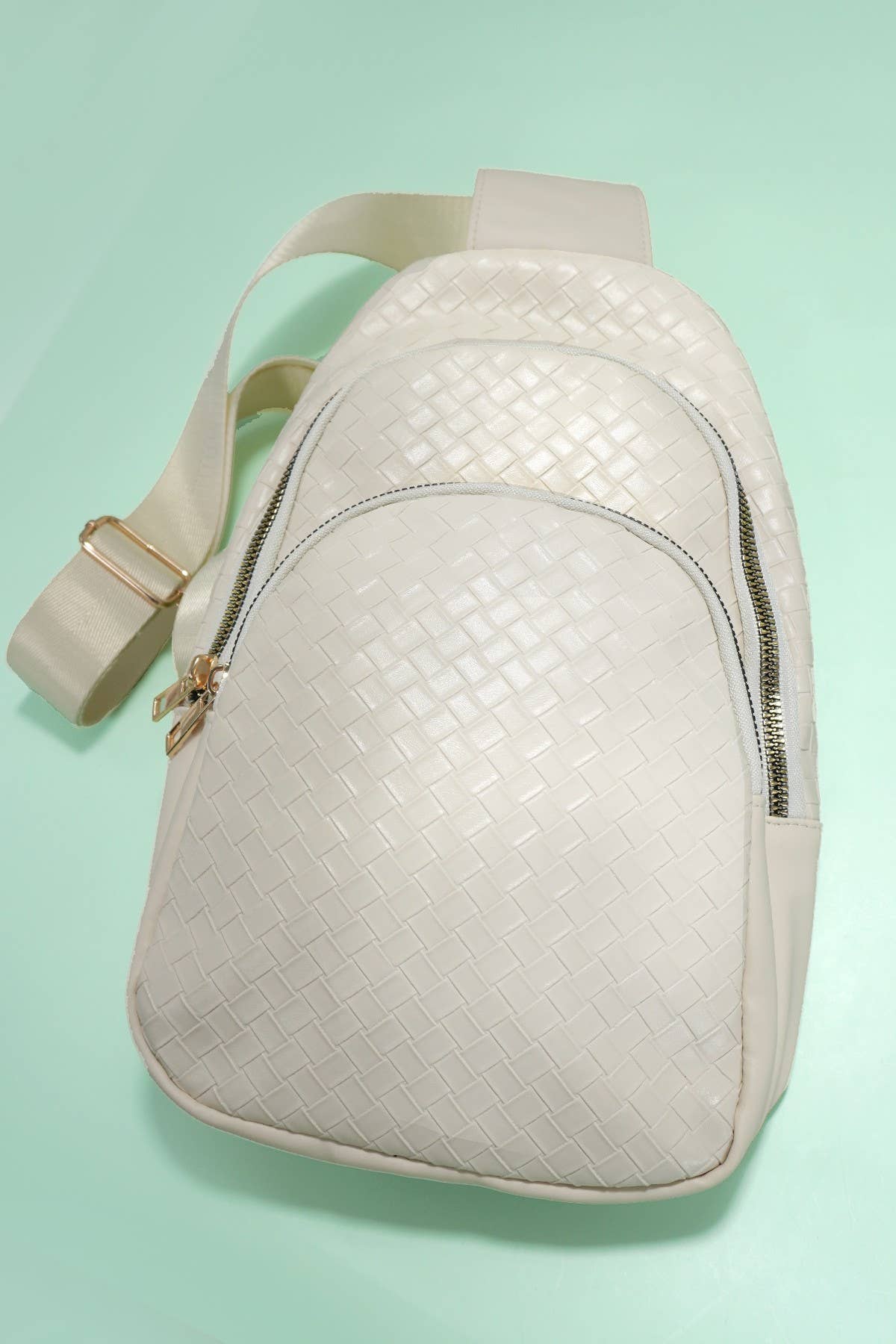 BRAIDED WEAVE VEGAN SLING CROSSBODY STADIUM BAG | 40P542