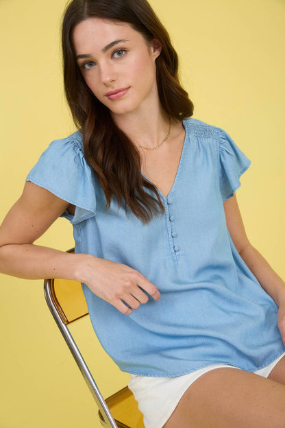 V NECK HALF BUTTON RUFFLE SLEEVE CHAMBRAY TOP